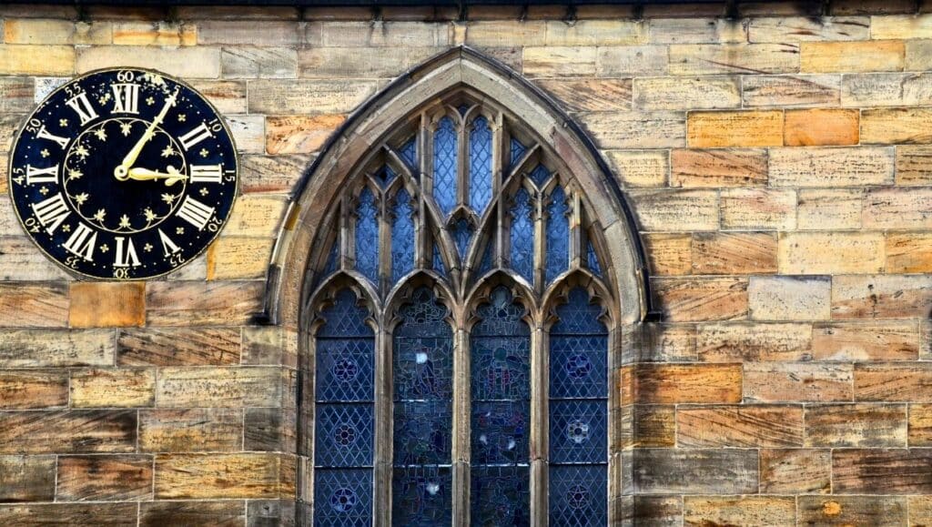 Image: Old window and clock, York, UK. Photo by Bara7 from Getty Images, courtesy of Canva. Digitally edited by Jacob Davis.