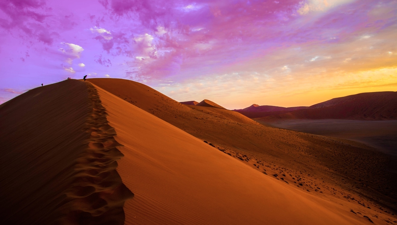 Desert sand dunes with footsteps for Lent.