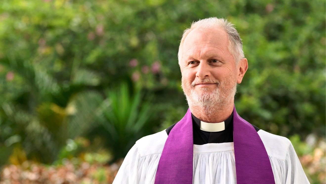 An Anglican priest outdoors. For Duties of a Rector.