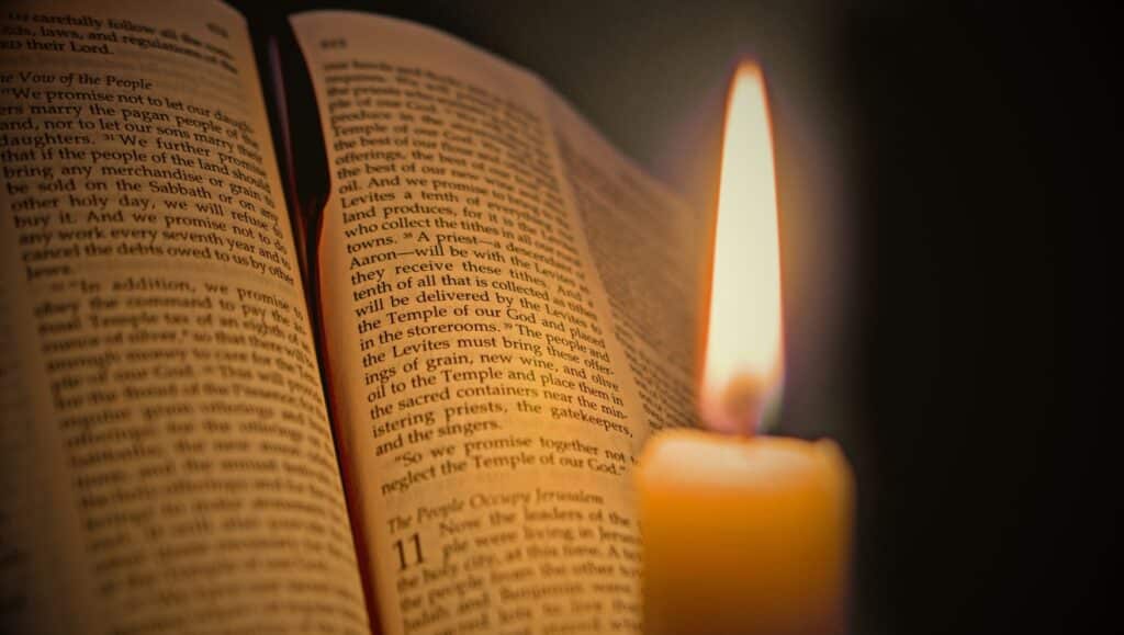 Bible with ribbon and candle for 500 Years of the Lectionary.