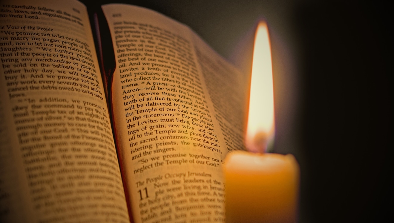 Bible with ribbon and candle for 500 Years of the Lectionary.