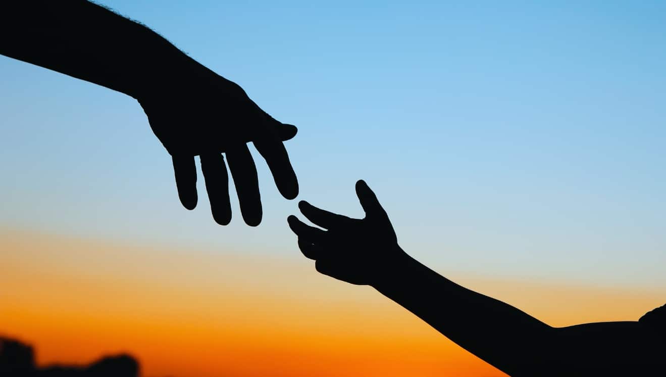 Hands of godparent and child. For Godparents RAG.