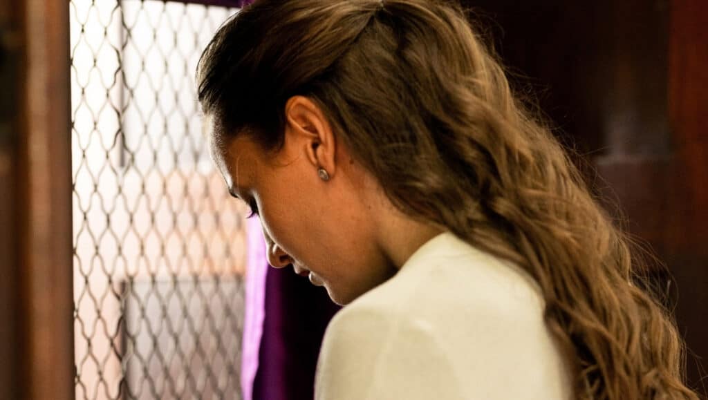 Woman practicing the Rite of Reconciliation.